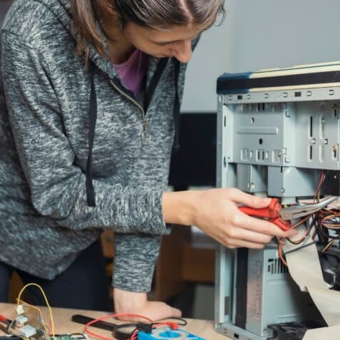 Women repairing tech